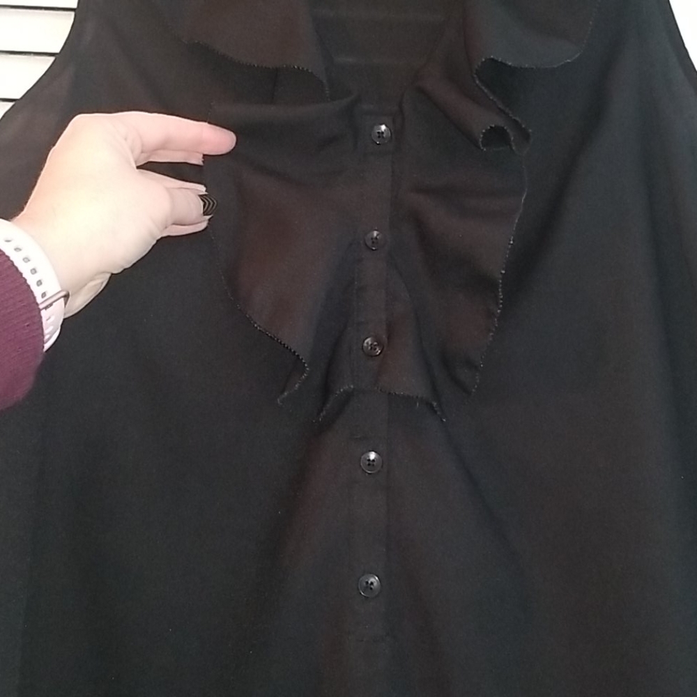 Black sleeveless ruffled blouse